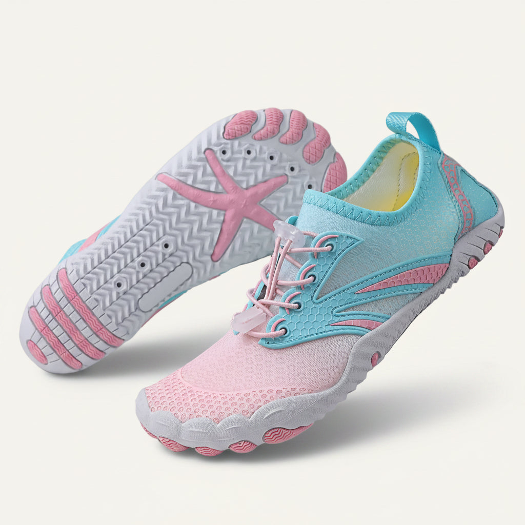 HydroFlex barfota vattenskor vuxna rosa/cyan – produktbild par skor visar sula med stjärnmönster på grön bakgrund | footflow